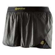 SKINS DNAmic Womens Superpose Short Svart/Gul X-Small Dame