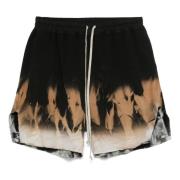 Løse shorts med solmotiv