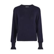 Feminin strikket pullover med volanger