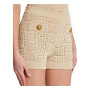 Monogrammet åpenstrikket mini shorts